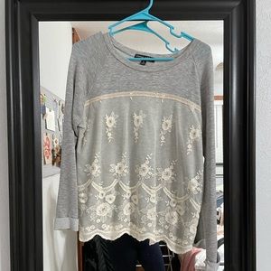 Grey long sleeve top with lace overlay.